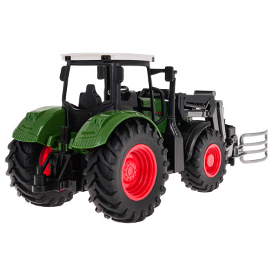 Žalias traktorius su griebtuvu